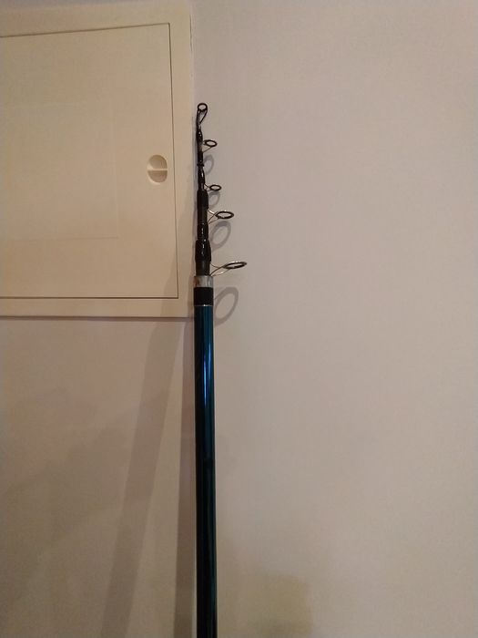 Cana surf ligeiro 4, 20m....50/100gr usada com carreto Okuma