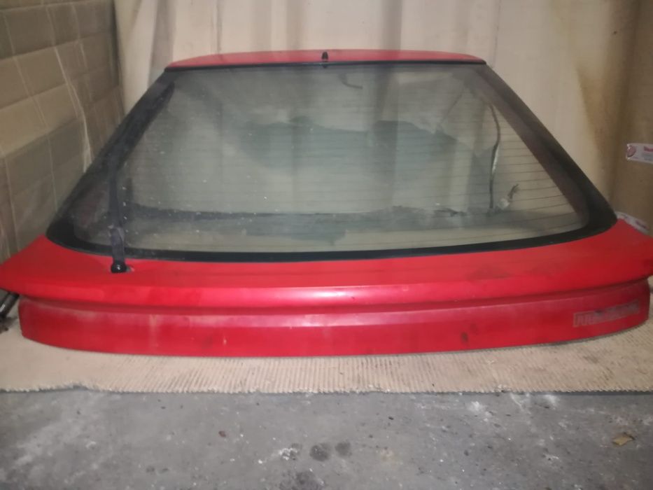 Tampa mala mazda 323