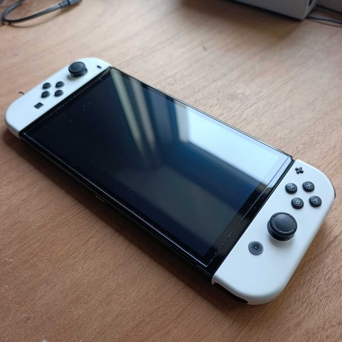 Nintendo Switch OLED + 6 Jogos + Pastinha