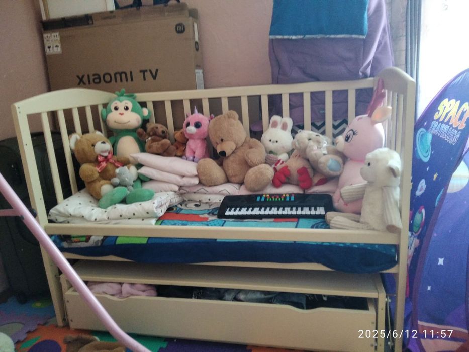 Дитяча кроватка маятник