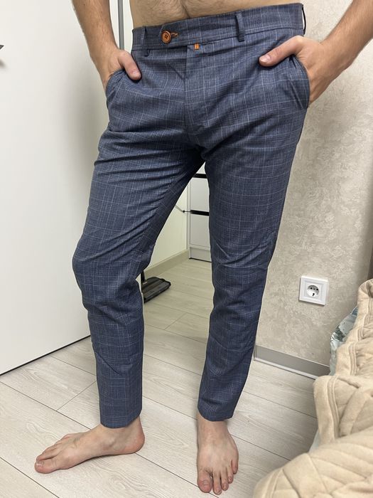 Чоловічі штани у клітинку