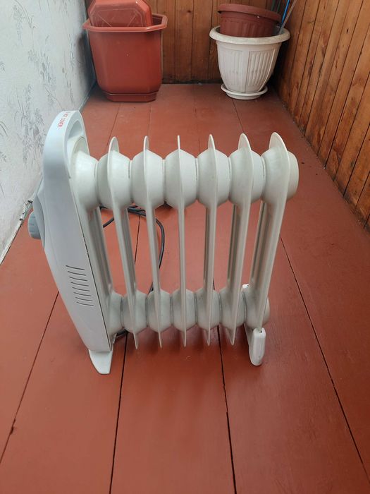 Електрообогреватель масляный. ROTEX на 6 секций.