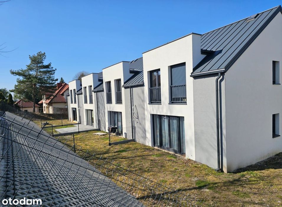 Dom w zabudowie szeregowej szeregówka garaż