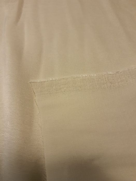 Tkanina kremowa szer.140 cm.