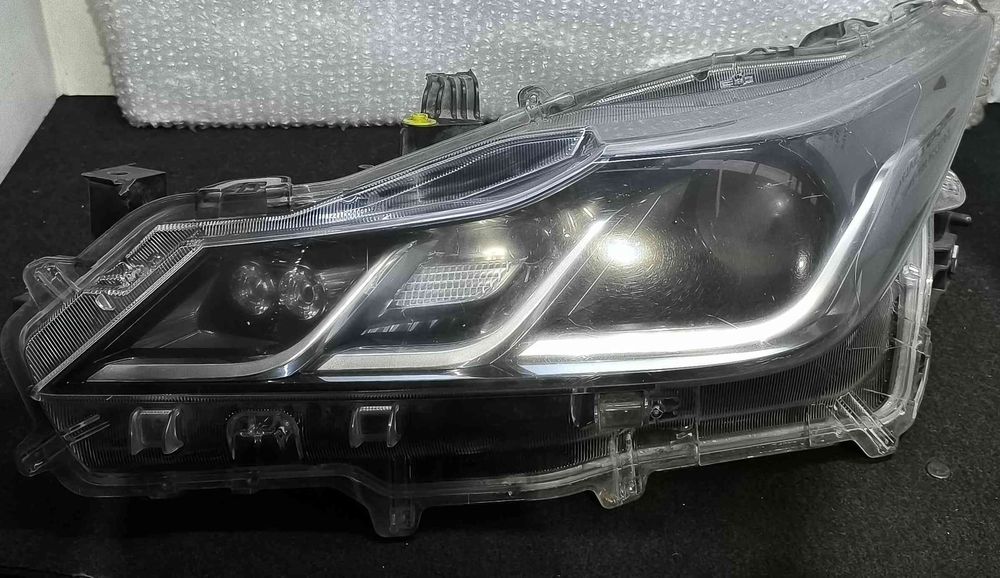 Ótica / Farol Esquerdo 81150-02T31-00 - TOYOTA COROLLA Hatchback