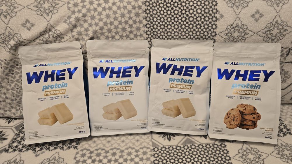 Nowe Opakowanie Białka Whey Protein Premium firmy Nutrition o smaku Biała Czekolada lub Happy Cookie 700g