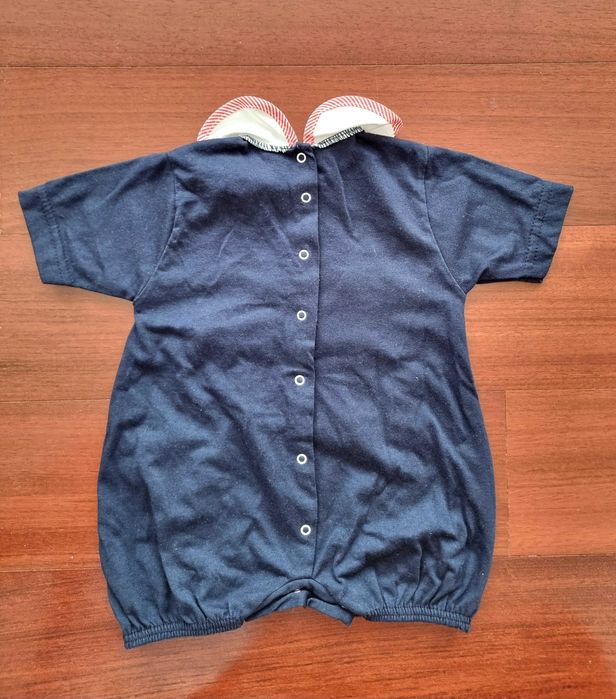 Romper azul com detalhe na gola e um urso 100% algodão, recém-nascido