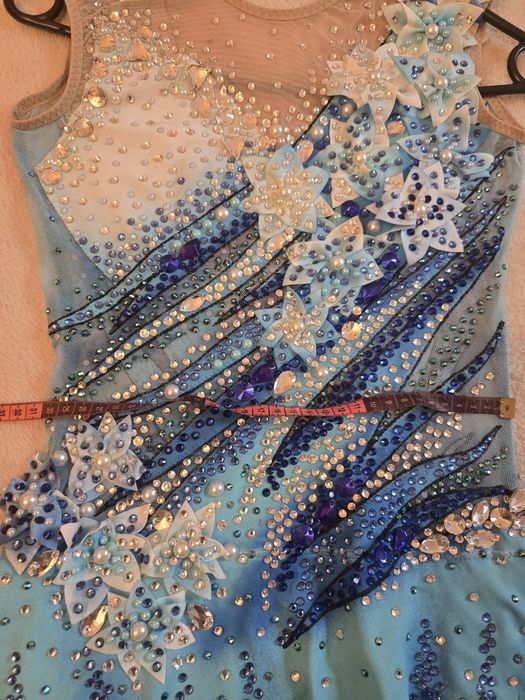 Ціну знижено!Неймовірний гімнастичний купальник 10-12 років.