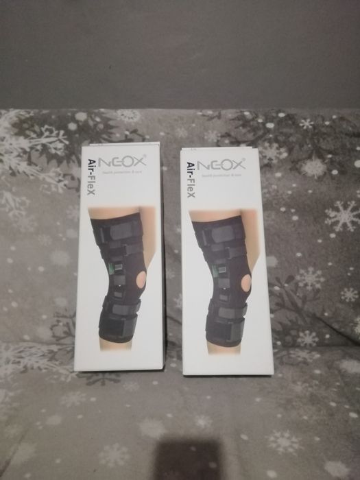 Długi stabilizator stawu kolanowego szynami dwuosiowymi