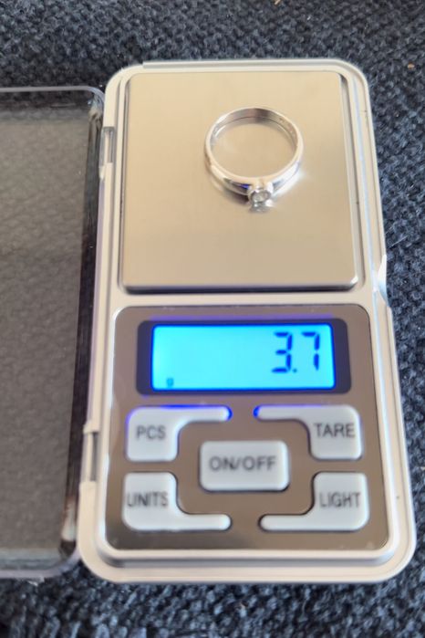 Anel ouro branco 19,2k com diamante