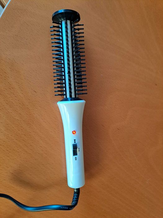 	Escova eléctrica de cabelo