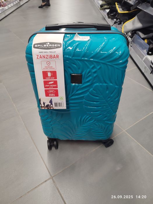 Nowa niebieska walizka podróżna kabinowa