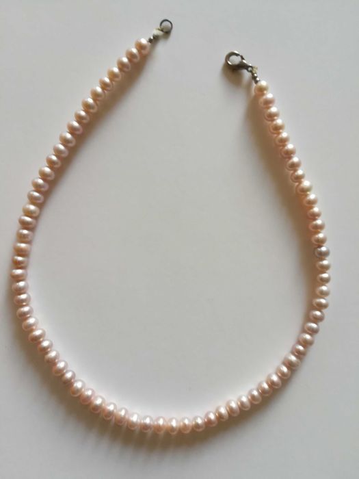 Розовый натуральный жемчуг.