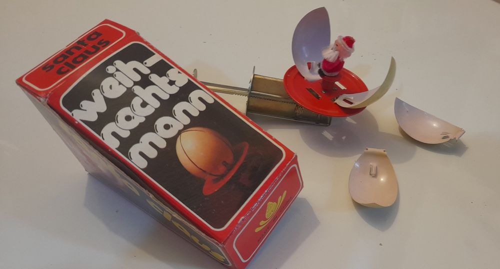 Brinquedo de lata mecânico pai natal com caixa