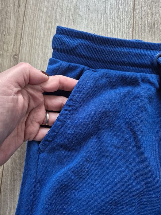 Jak nowe! Spodnie dresowe dziecięce, Cool Club, c. niebieskie, r 128