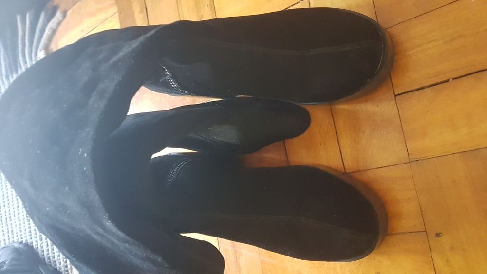 Botas pretas cano alto