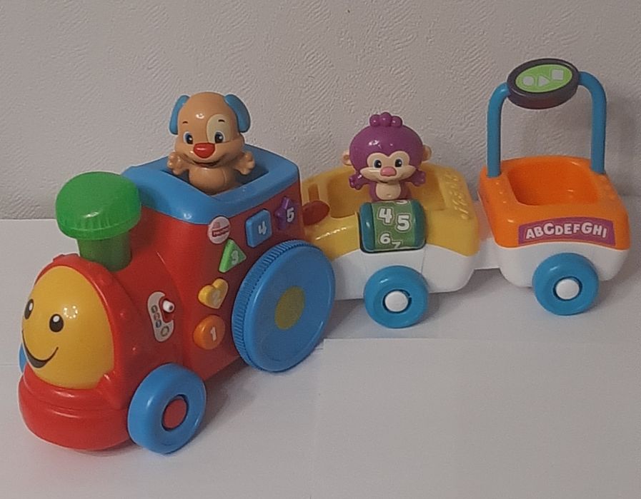 Развивающая игрушка "Поезд умного щенка" от бренда  Fisher Price