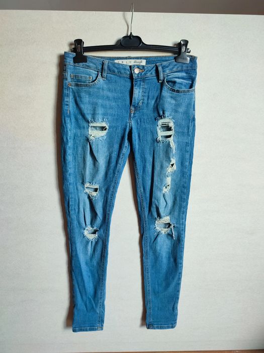 Jeansy z dziurami Denim Co