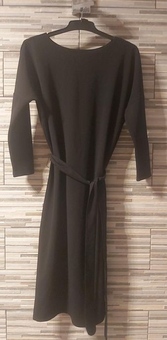 Sukienka wizytowa na sylwestra zimowa Eleganckado botkow kozakow