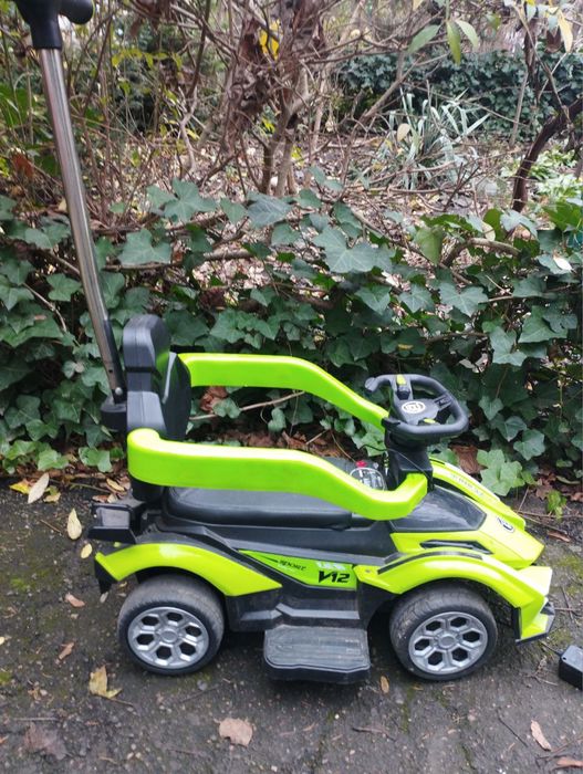 Дитяча машинка з електродвигуном та музикою з батьківською ручкою