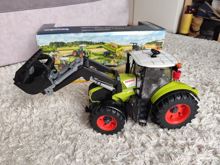 Bruder class axion 950 z ładowaczem jak nowy