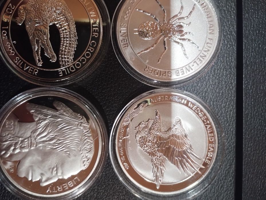 Продам посеребренные монеты,исчезающие виды животных наборами по супер