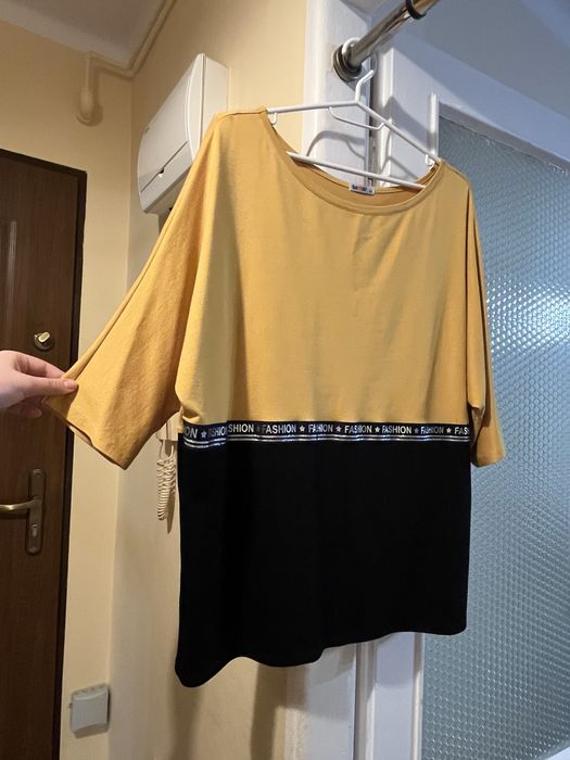 Żółta czarna bluzka nietoperz elegancka