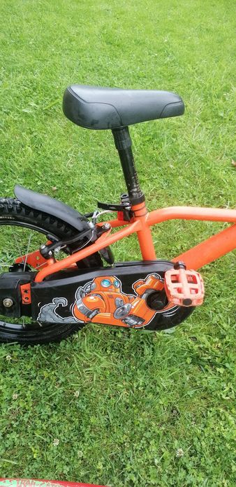 Rower Btwin pomarańczowy, hol rowerowy trail gator, kółka