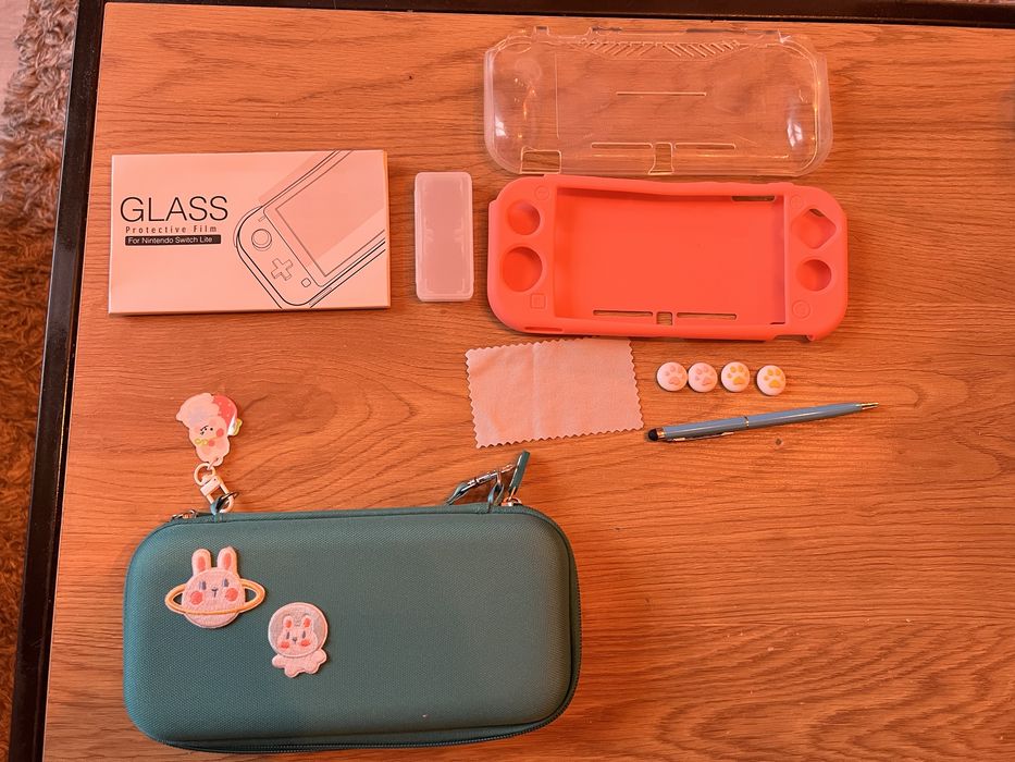 Nintendo switch lite + smerfy więzień zielonego kamienia 2