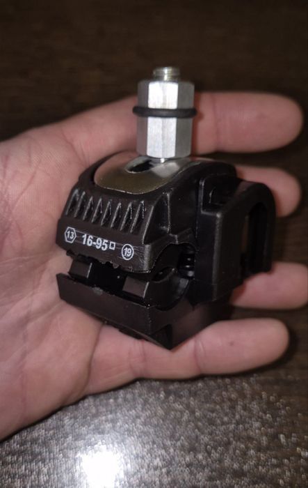 Затискач проколюючий (відгалужувальний)