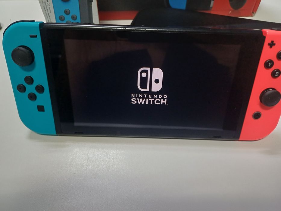 Nintendo + comando extra + bolsa