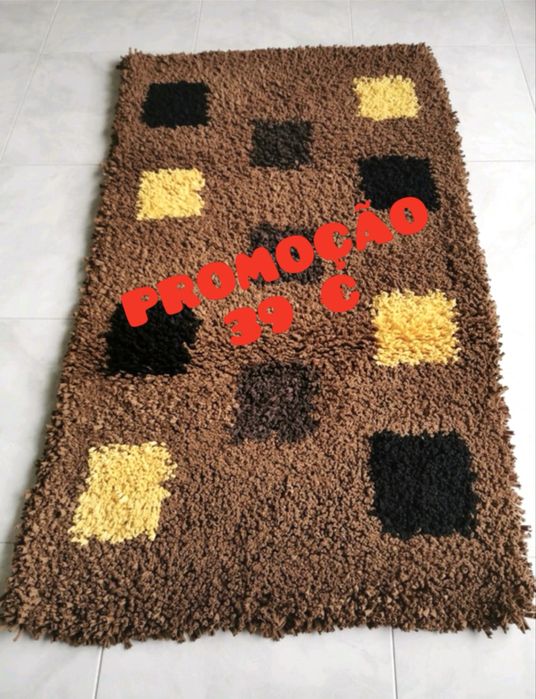 Camel-colored rug with black and yellow accents