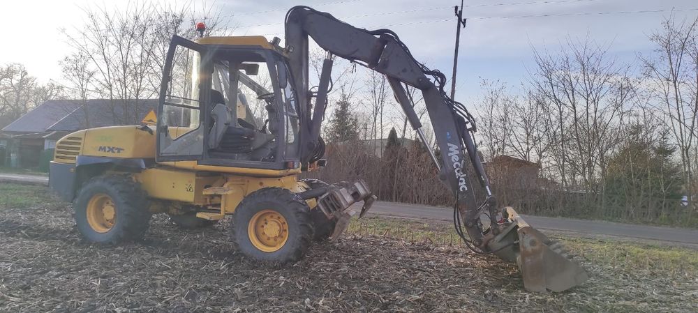 Usługi koparko ładowarki mecalac