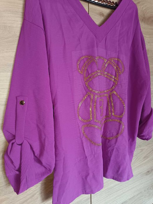 Nowa piękna bluzka z wywijanym rękawem