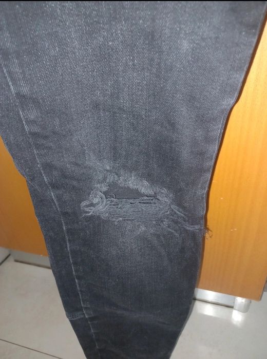 Calças de ganga rasgadas