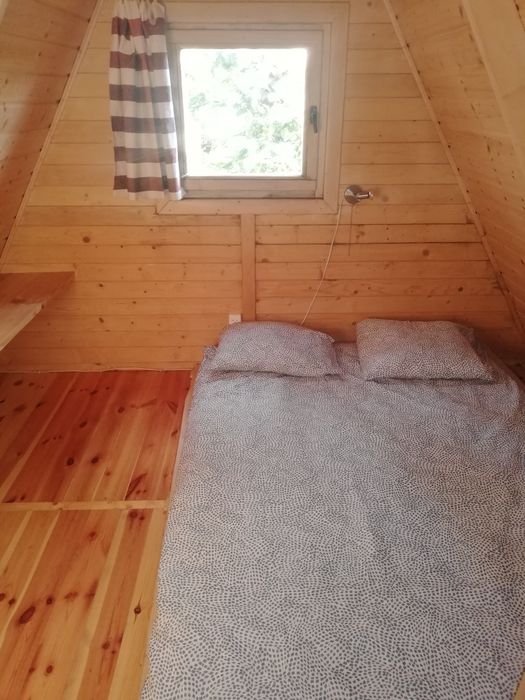 Drewniany domek nad jeziorem Tajty