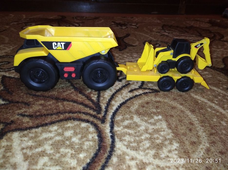 машинки CAT бу вантажівка самоскид трактор