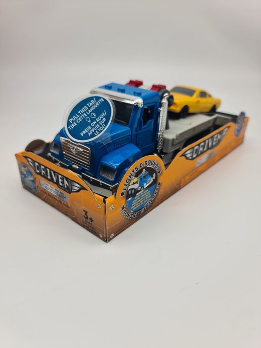 Brinquedo camião reboque com carro - novo