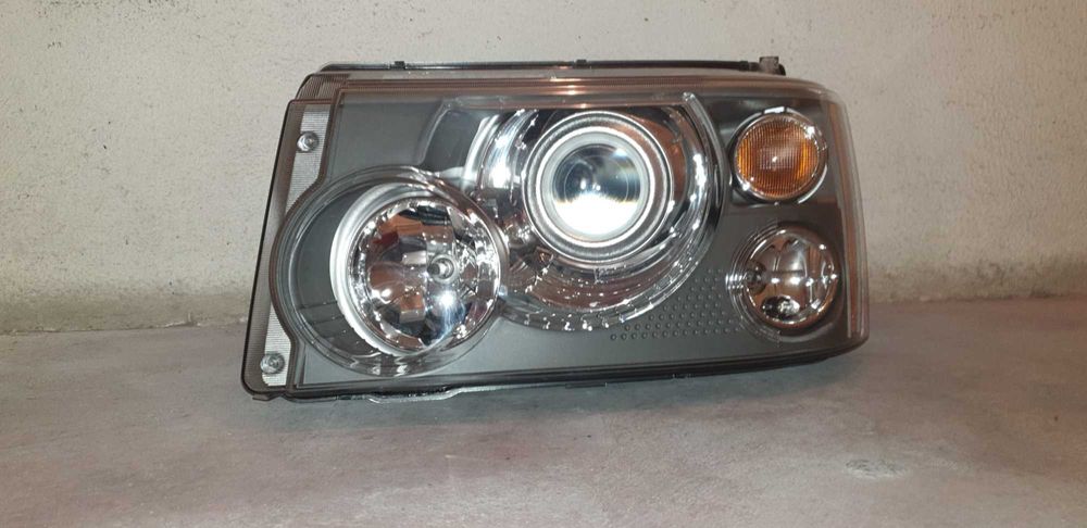 Farol range rover sport
