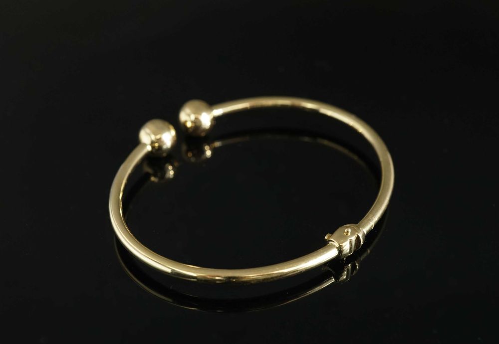 Złoto 585 - Złota damska bransoletka bangle z kulkami.