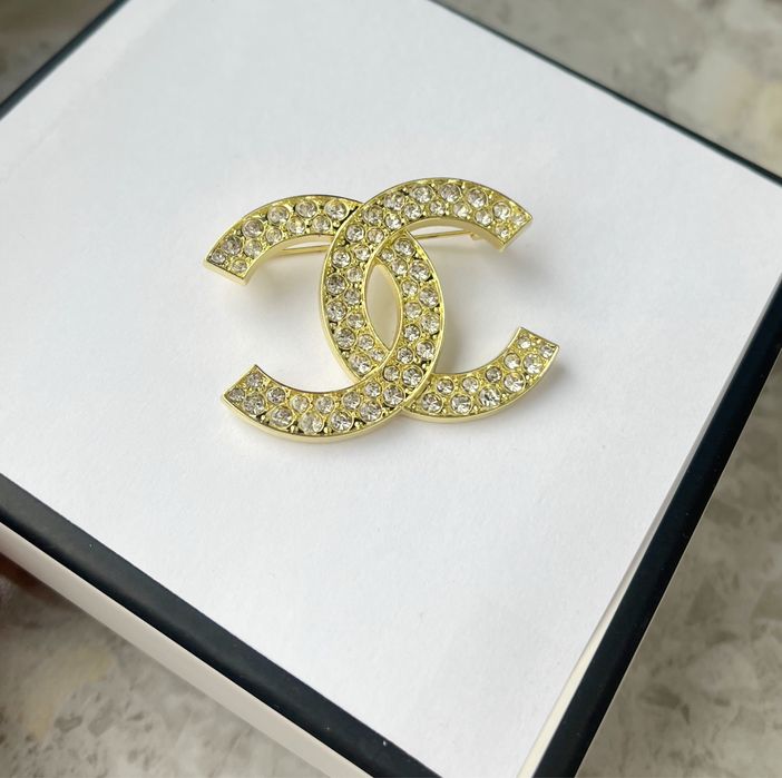 Broszka cyrkonie pozlacana metalowa