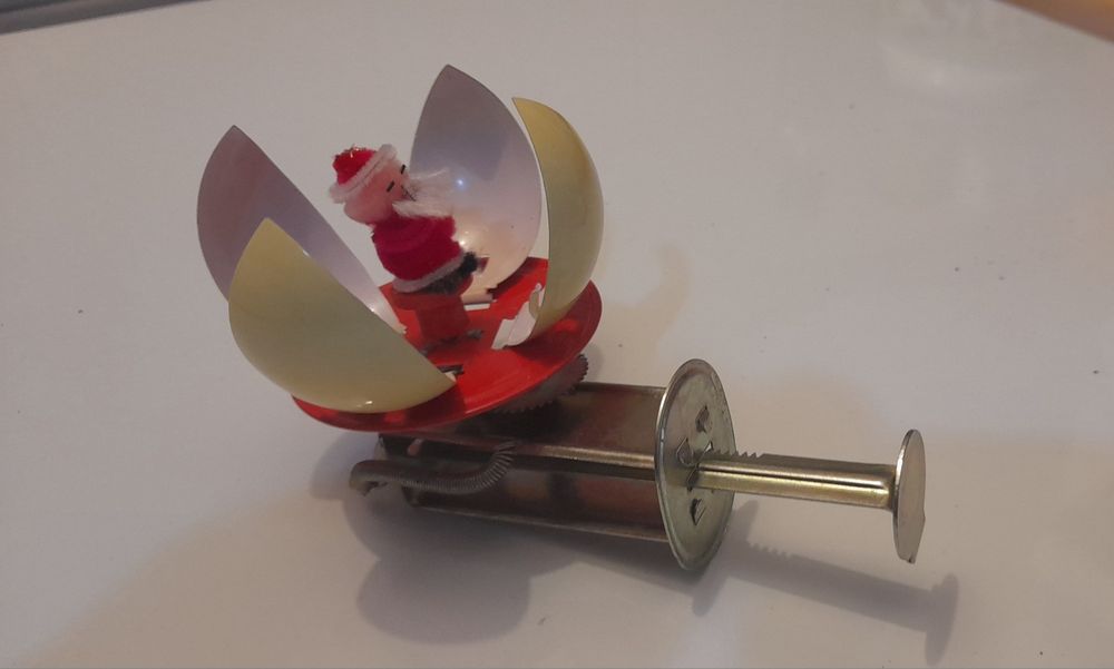 Brinquedo de lata mecânico pai natal com caixa