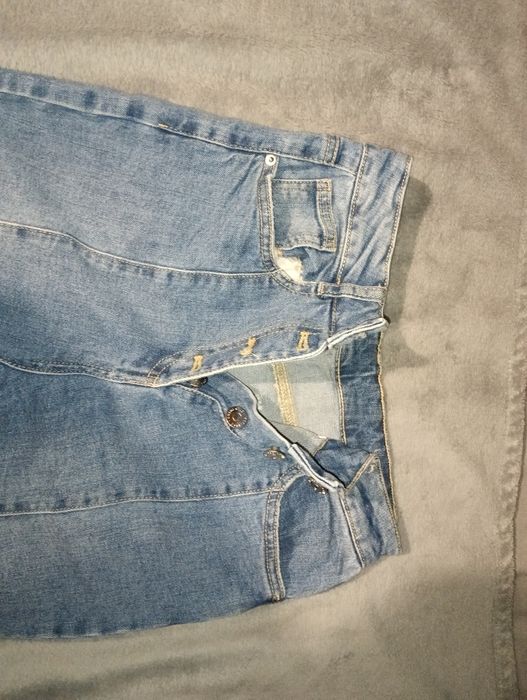 Сині кльош джинси