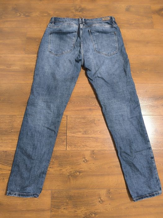 Spodnie jeansowe z przetarciami W30/34