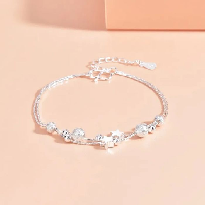 Pulseira/tornozeleira prateada com estrelas e bolinhas