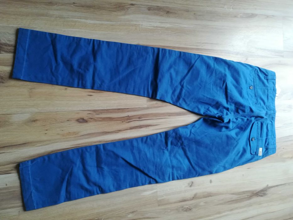Niebieskie spodnie jeansy slim, rozmiar 28