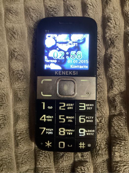 Кенексі кнопочний телефон