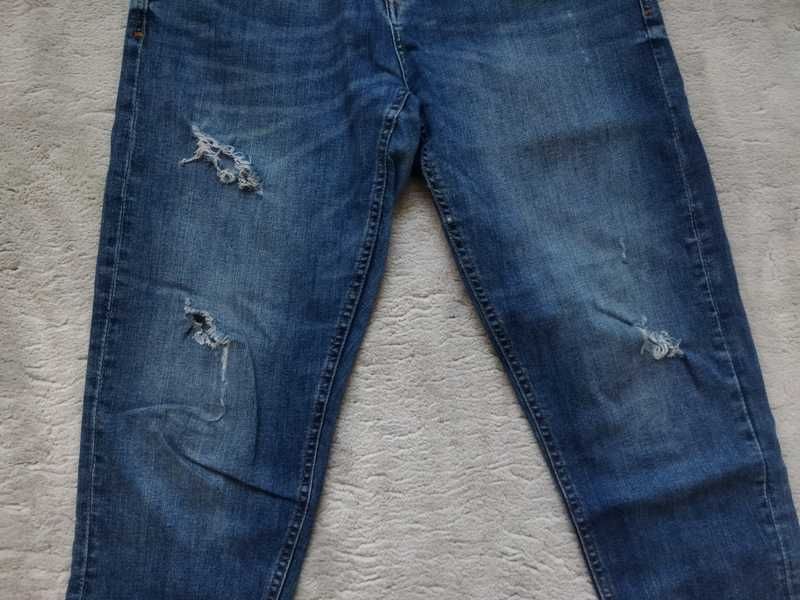 Spodnie jeansowe damskie Reserved. Rozmiar 40. Dziury przetarcia