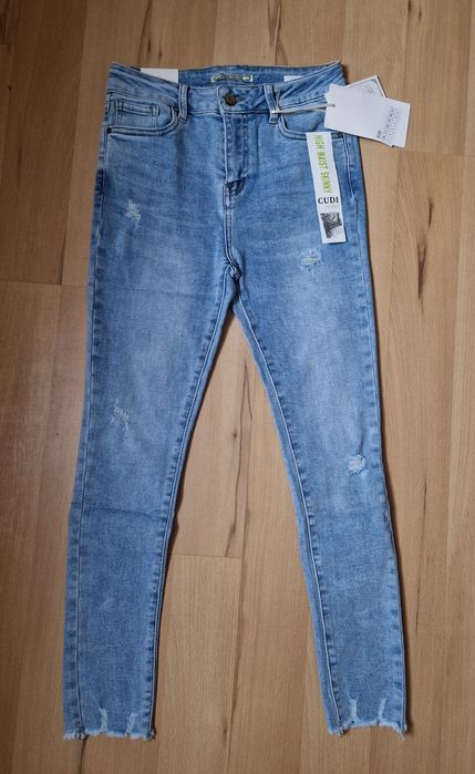 Spodnie damskie jeansowe z przetarciami Cudi Nowe