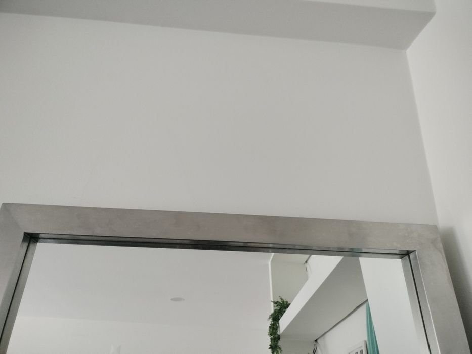 Espelho com moldura em inox